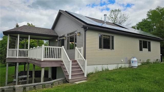 746 Gospel Hill Rd, Guilford, NY 13780 - back of house featuring a yard, roof mounted solar panels, stairway, and a deck