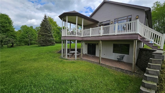 746 Gospel Hill Rd, Guilford, NY 13780 - back of property with a lawn, a patio, a wooden deck, and stairs