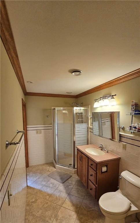 746 Gospel Hill Rd, Guilford, NY 13780 - full bath featuring tile walls, vanity, crown molding, a shower stall, and a wainscoted wall