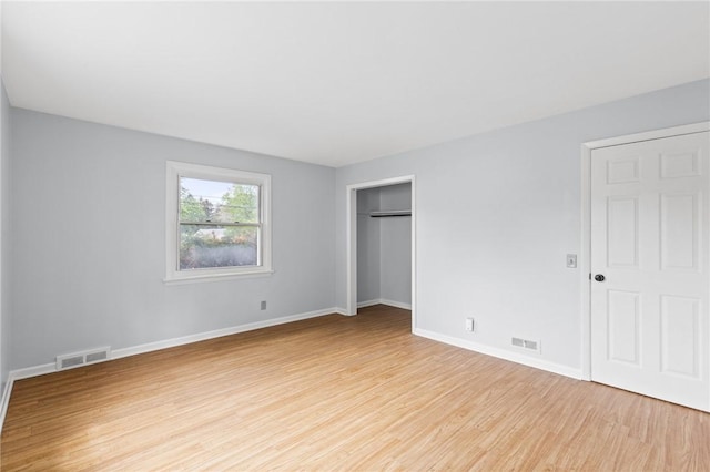 2200 W Henrietta Rd, Brighton, NY 14623 - unfurnished bedroom featuring light wood-style floors, baseboards, and a closet