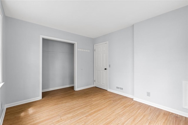 2200 W Henrietta Rd, Brighton, NY 14623 - unfurnished bedroom featuring light wood finished floors, baseboards, and a closet