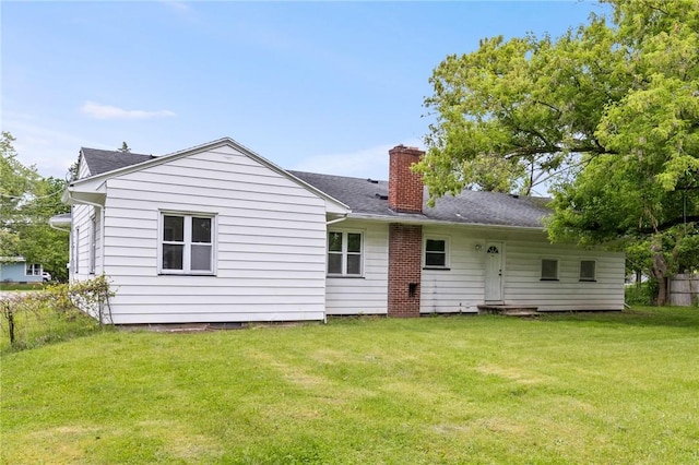 2200 W Henrietta Rd, Brighton, NY 14623 - rear view of house with a lawn, a chimney, and a shingled roof