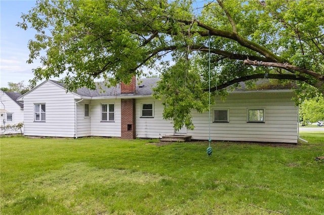 2200 W Henrietta Rd, Brighton, NY 14623 - rear view of house featuring a chimney and a yard