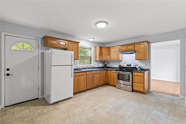 2200 W Henrietta Rd, Brighton, NY 14623 - kitchen featuring freestanding refrigerator, stainless steel range with electric stovetop, dark countertops, and plenty of natural light