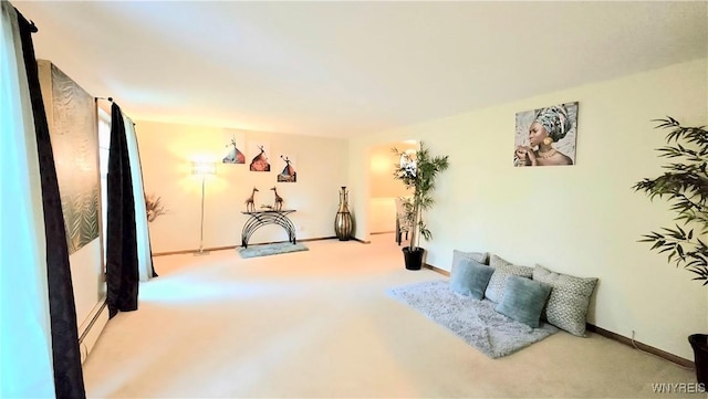 48 Presidio Pl, Amherst, NY 14221 - living area with carpet flooring, a baseboard heating unit, and baseboards