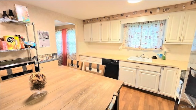48 Presidio Pl, Amherst, NY 14221 - kitchen with black dishwasher, light countertops, white cabinets, and light wood-style flooring