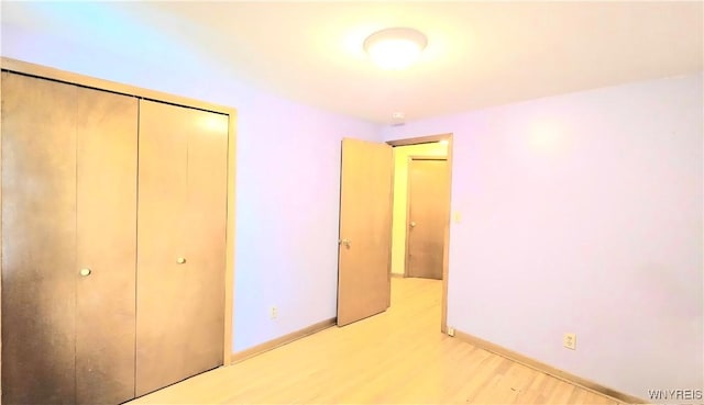 48 Presidio Pl, Amherst, NY 14221 - unfurnished bedroom featuring light wood finished floors, a closet, and baseboards