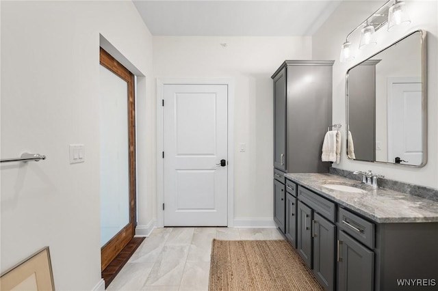 107 California Dr Unit G, Amherst, NY 14221 - bathroom with vanity and baseboards