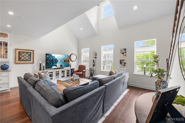 107 California Dr Unit G, Amherst, NY 14221 - living room with high vaulted ceiling, dark wood-type flooring, healthy amount of natural light, recessed lighting, and baseboards
