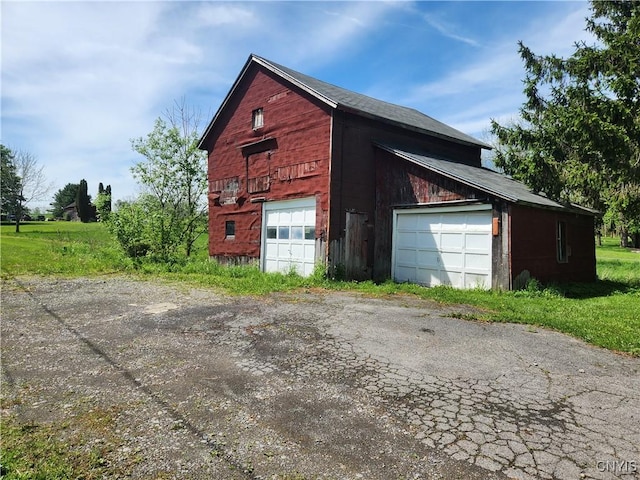 768 Crow Hill Rd, Skaneateles, NY 13152 - view of side of home featuring a garage and an outdoor structure