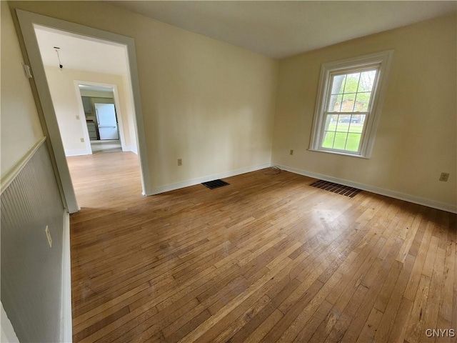 768 Crow Hill Rd, Skaneateles, NY 13152 - empty room with hardwood / wood-style flooring and baseboards