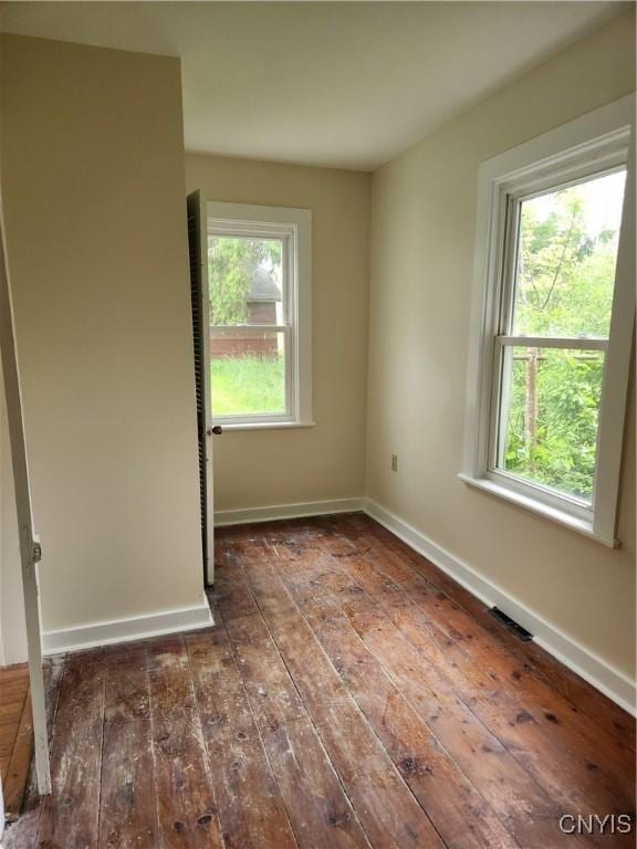 768 Crow Hill Rd, Skaneateles, NY 13152 - unfurnished room featuring hardwood / wood-style flooring, healthy amount of natural light, and baseboards