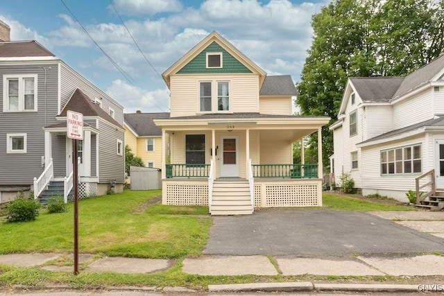 264 S 5th St, Fulton, NY 13069 - view of front of property with covered porch and a front lawn
