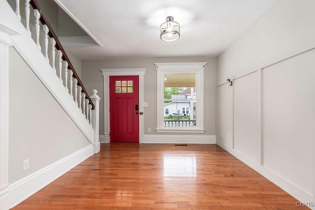 264 S 5th St, Fulton, NY 13069 - entryway featuring stairs, light wood finished floors, and baseboards