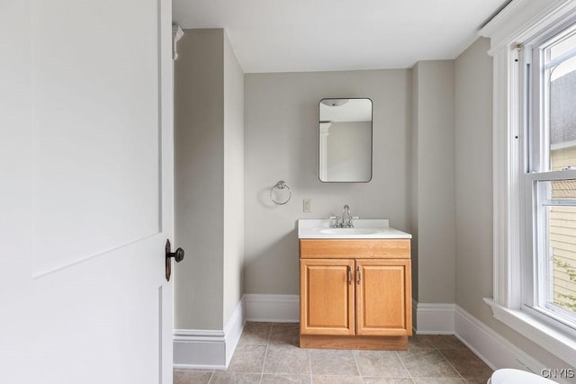 264 S 5th St, Fulton, NY 13069 - bathroom with vanity, baseboards, and tile patterned flooring
