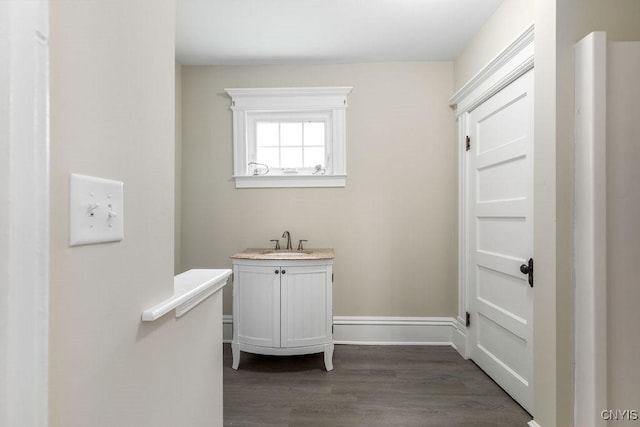 264 S 5th St, Fulton, NY 13069 - bathroom with vanity, wood finished floors, and baseboards
