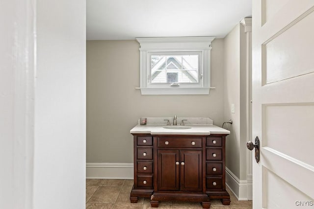 264 S 5th St, Fulton, NY 13069 - bathroom with vanity, tile patterned floors, and baseboards