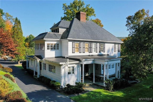 80 Lake St, Urbana, NY 14840 - back of house with a chimney