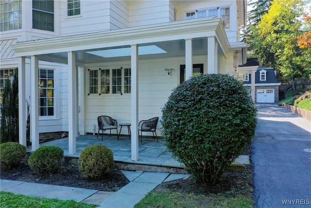 80 Lake St, Urbana, NY 14840 - property entrance featuring a porch and driveway