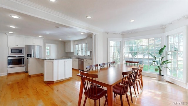80 Lake St, Urbana, NY 14840 - dining space featuring ornamental molding, recessed lighting, light wood-type flooring, and baseboards