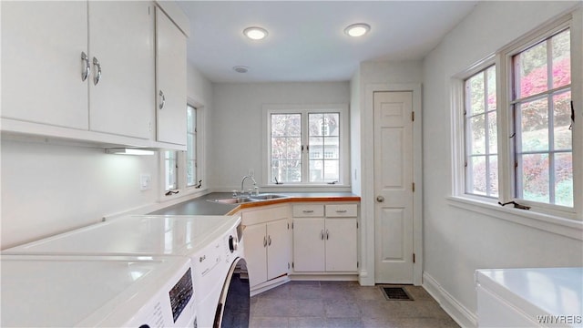 80 Lake St, Urbana, NY 14840 - washroom with cabinet space, washer and clothes dryer, plenty of natural light, and baseboards