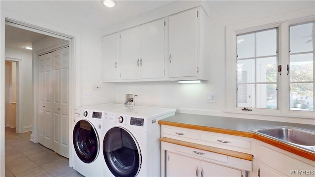 80 Lake St, Urbana, NY 14840 - washroom with washing machine and dryer, cabinet space, and light tile patterned flooring