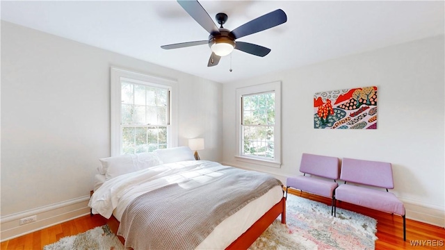 80 Lake St, Urbana, NY 14840 - bedroom featuring baseboards, wood finished floors, and ceiling fan