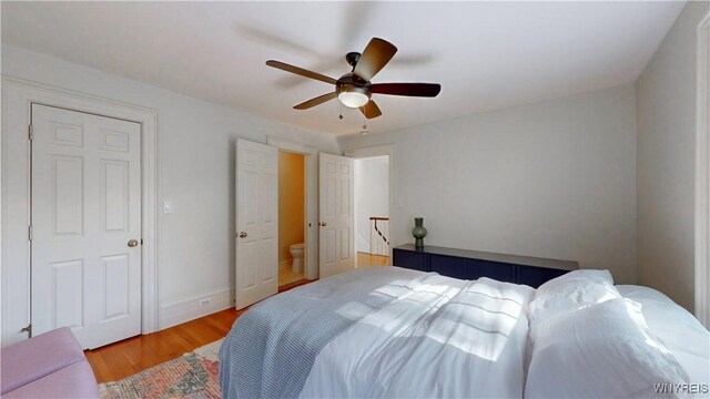 80 Lake St, Urbana, NY 14840 - bedroom with light wood-style floors, a ceiling fan, and baseboards