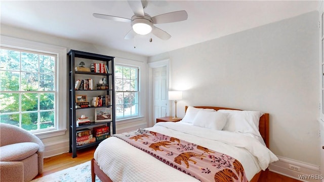 80 Lake St, Urbana, NY 14840 - bedroom featuring light wood finished floors, baseboards, and a ceiling fan