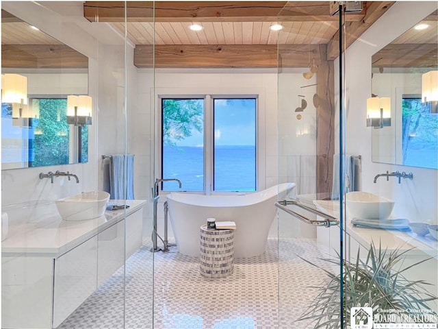 6007 Tinkertown Dr, Chautauqua, NY 14728 - bathroom with a freestanding tub, wood ceiling with exposed beams, recessed lighting, vanity, and a shower stall