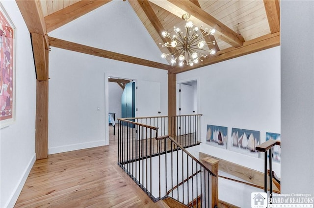 6007 Tinkertown Dr, Chautauqua, NY 14728 - stairway featuring a chandelier, wood finished floors, baseboards, high vaulted ceiling, and wood ceiling with exposed beams