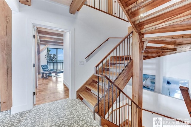 6007 Tinkertown Dr, Chautauqua, NY 14728 - staircase featuring beam ceiling