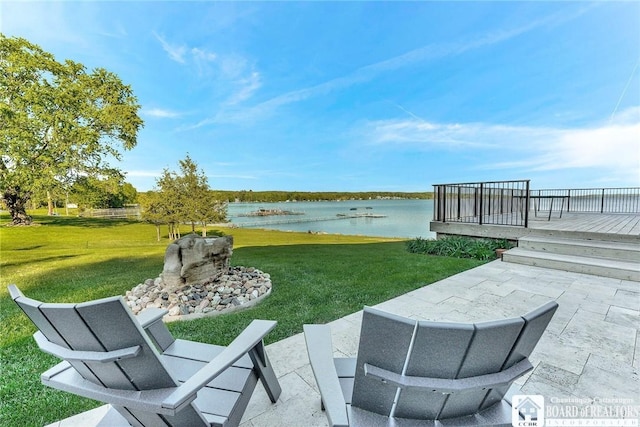 6007 Tinkertown Dr, Chautauqua, NY 14728 - view of green lawn with a water view and a patio area