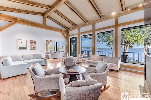 6007 Tinkertown Dr, Chautauqua, NY 14728 - living area with a water view, light wood-style floors, beam ceiling, and high vaulted ceiling