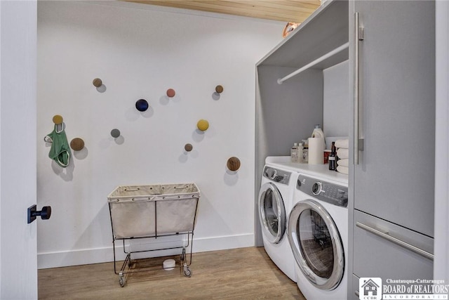 6007 Tinkertown Dr, Chautauqua, NY 14728 - washroom with washer and dryer, light wood finished floors, and baseboards