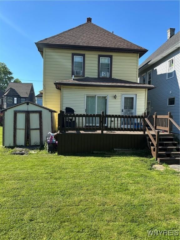 125 Spaulding St, Buffalo, NY 14220 - rear view of house with a wooden deck, a lawn, and roof with shingles