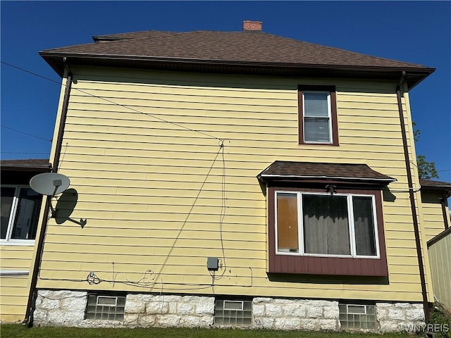 125 Spaulding St, Buffalo, NY 14220 - view of home's exterior featuring a chimney and a shingled roof