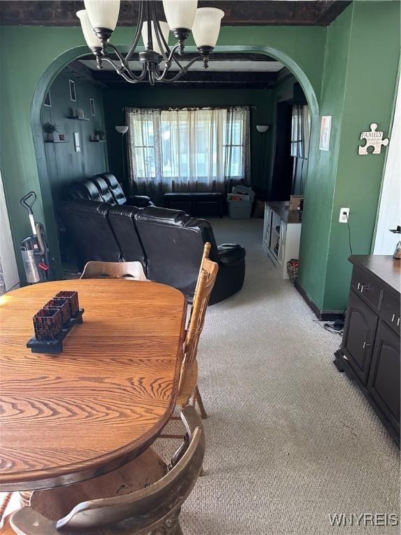 125 Spaulding St, Buffalo, NY 14220 - dining area featuring arched walkways, carpet, and a chandelier