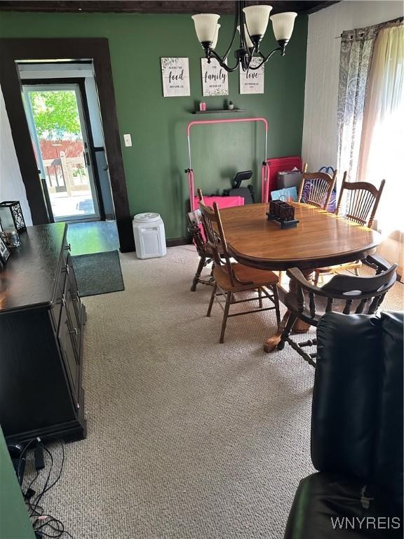 125 Spaulding St, Buffalo, NY 14220 - dining space with carpet floors and a chandelier