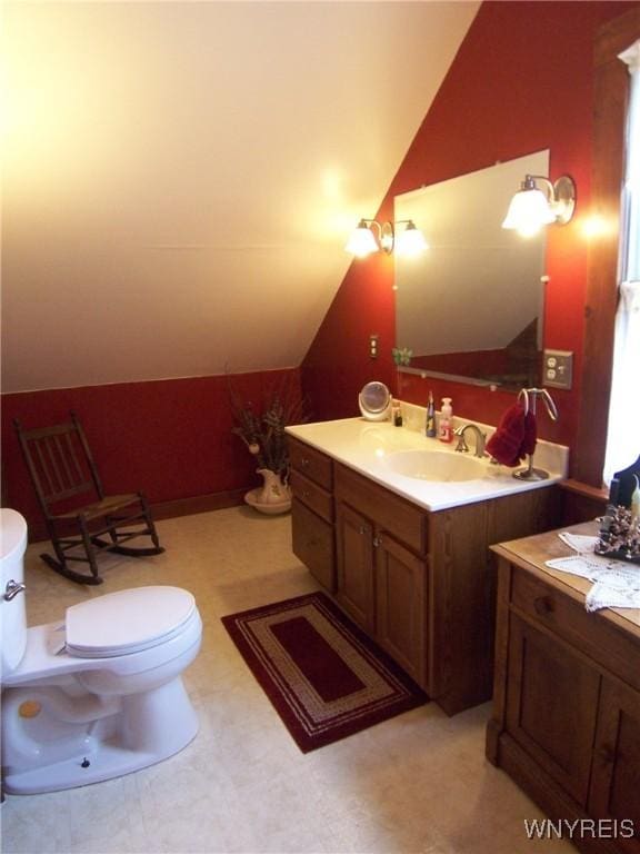 8330 Greiner Rd, Clarence, NY 14221 - bathroom with vaulted ceiling, vanity, and toilet