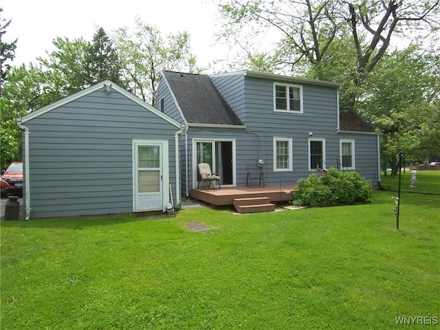 8330 Greiner Rd, Clarence, NY 14221 - back of property with a deck, a yard, and roof with shingles