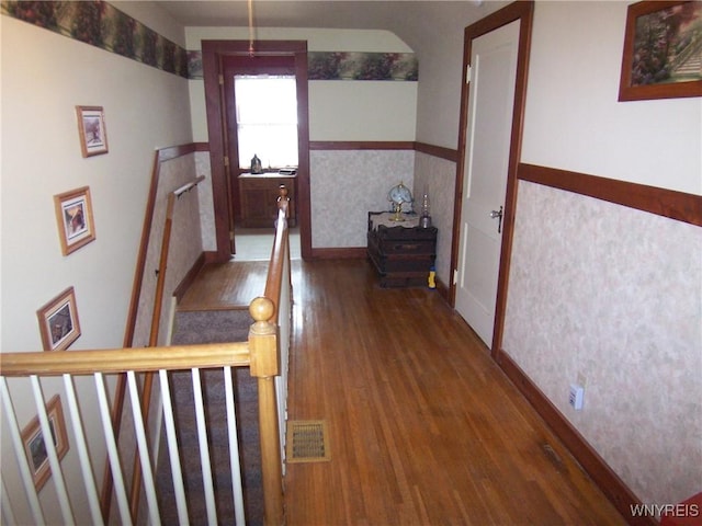 8330 Greiner Rd, Clarence, NY 14221 - corridor with wood finished floors, an upstairs landing, and a wainscoted wall