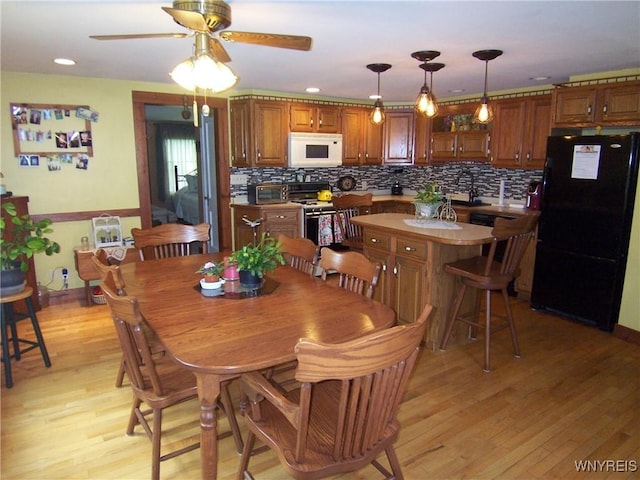 8330 Greiner Rd, Clarence, NY 14221 - dining area with ceiling fan, light wood finished floors, and recessed lighting