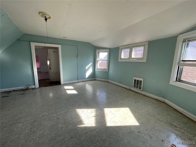 500 Massachusetts Ave, Buffalo, NY 14213 - unfurnished room with lofted ceiling, baseboards, healthy amount of natural light, and heating unit