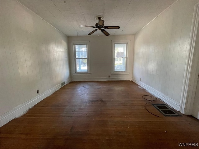 500 Massachusetts Ave, Buffalo, NY 14213 - empty room with hardwood / wood-style flooring, a ceiling fan, wood walls, and baseboards