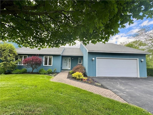 111 Spyglass Ln, Manlius, NY 13066 - ranch-style home with an attached garage, a front lawn, and asphalt driveway