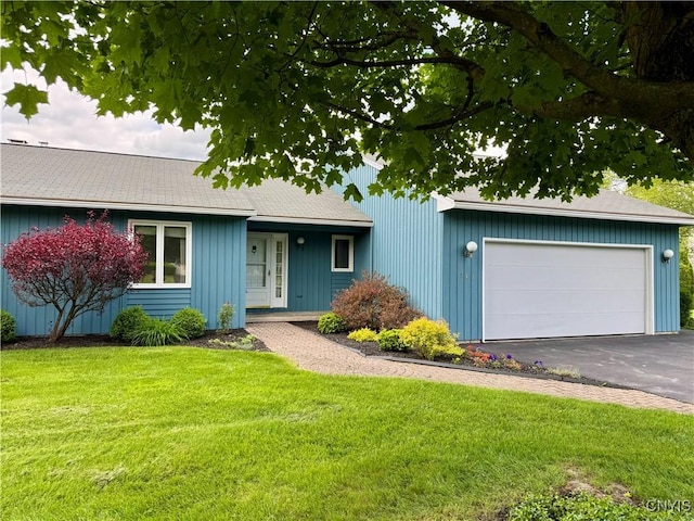 111 Spyglass Ln, Manlius, NY 13066 - single story home featuring asphalt driveway, a front yard, and an attached garage