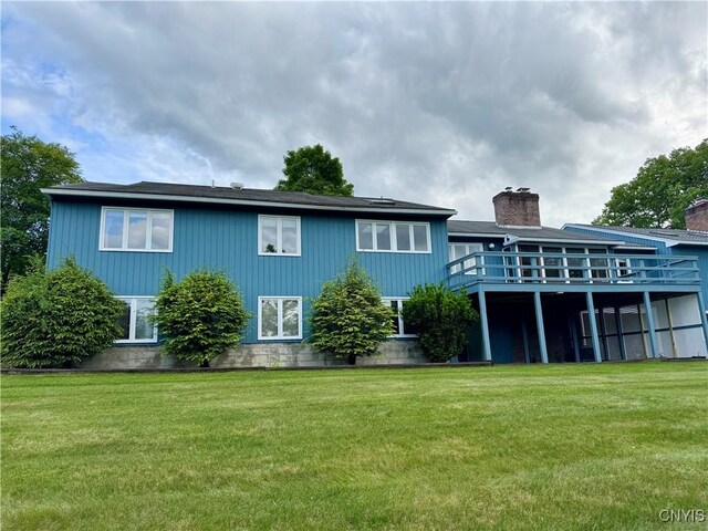 111 Spyglass Ln, Manlius, NY 13066 - back of house featuring a yard, a wooden deck, and a chimney