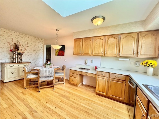 111 Spyglass Ln, Manlius, NY 13066 - kitchen with wallpapered walls, dishwasher, light wood finished floors, light countertops, and decorative light fixtures