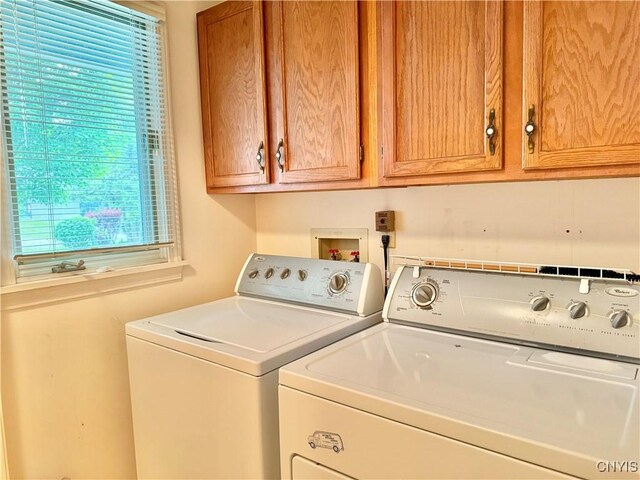 111 Spyglass Ln, Manlius, NY 13066 - laundry room featuring separate washer and dryer, plenty of natural light, and cabinet space
